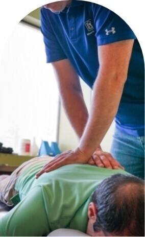 Dr. Bernstein adjusting a man's back